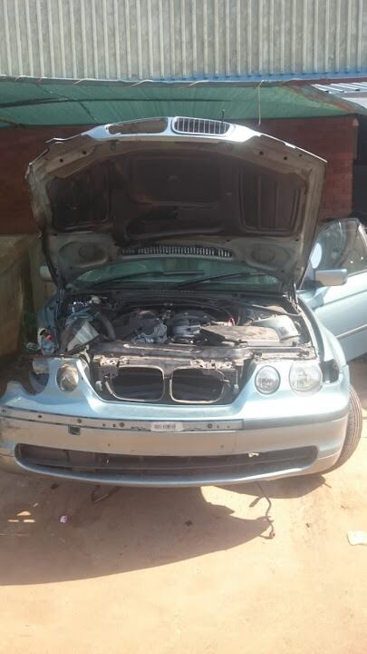 The 2003 BMW 318i E46 before modification - collision damaged hatchback