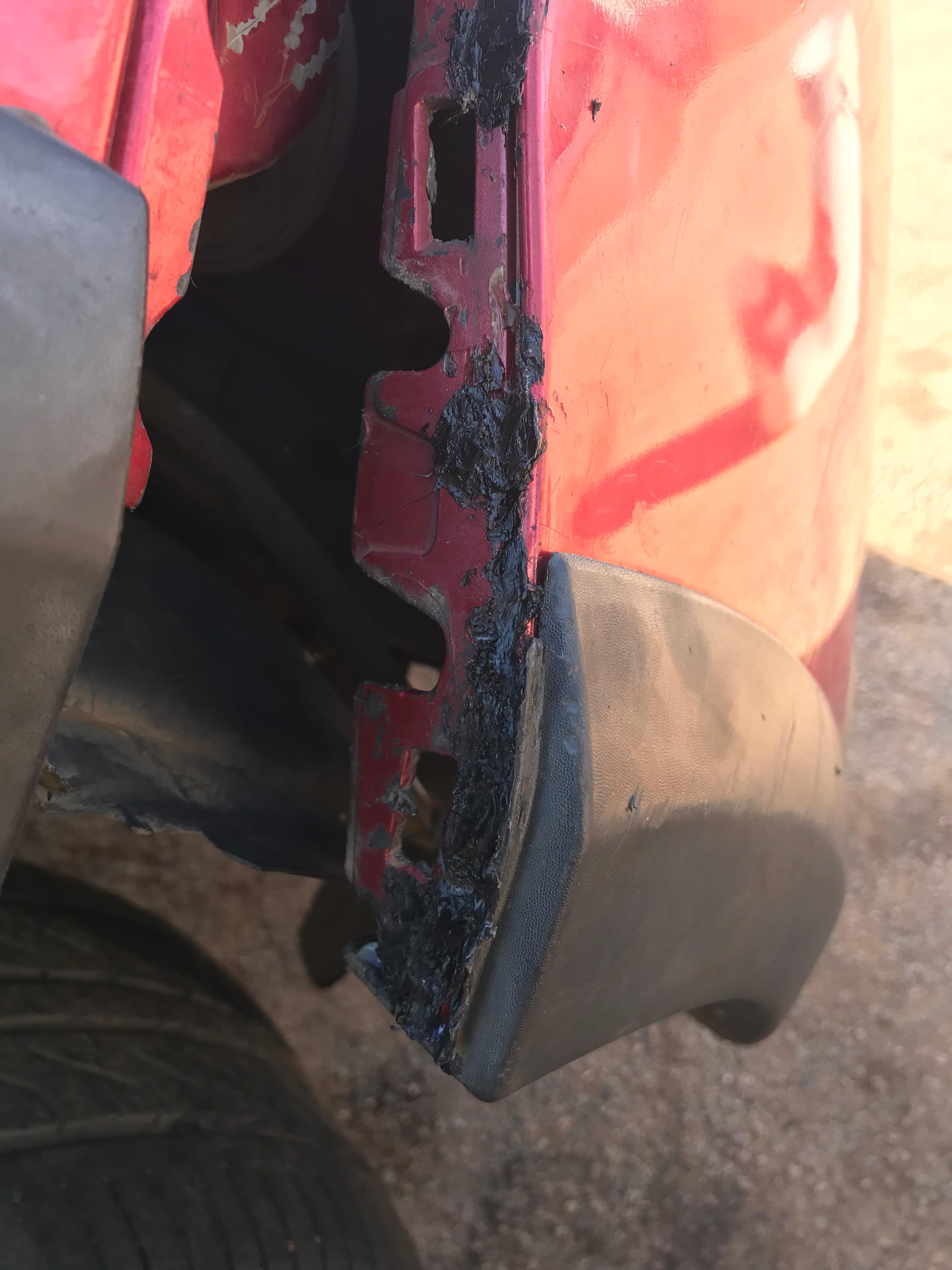 Red car fender sealing work