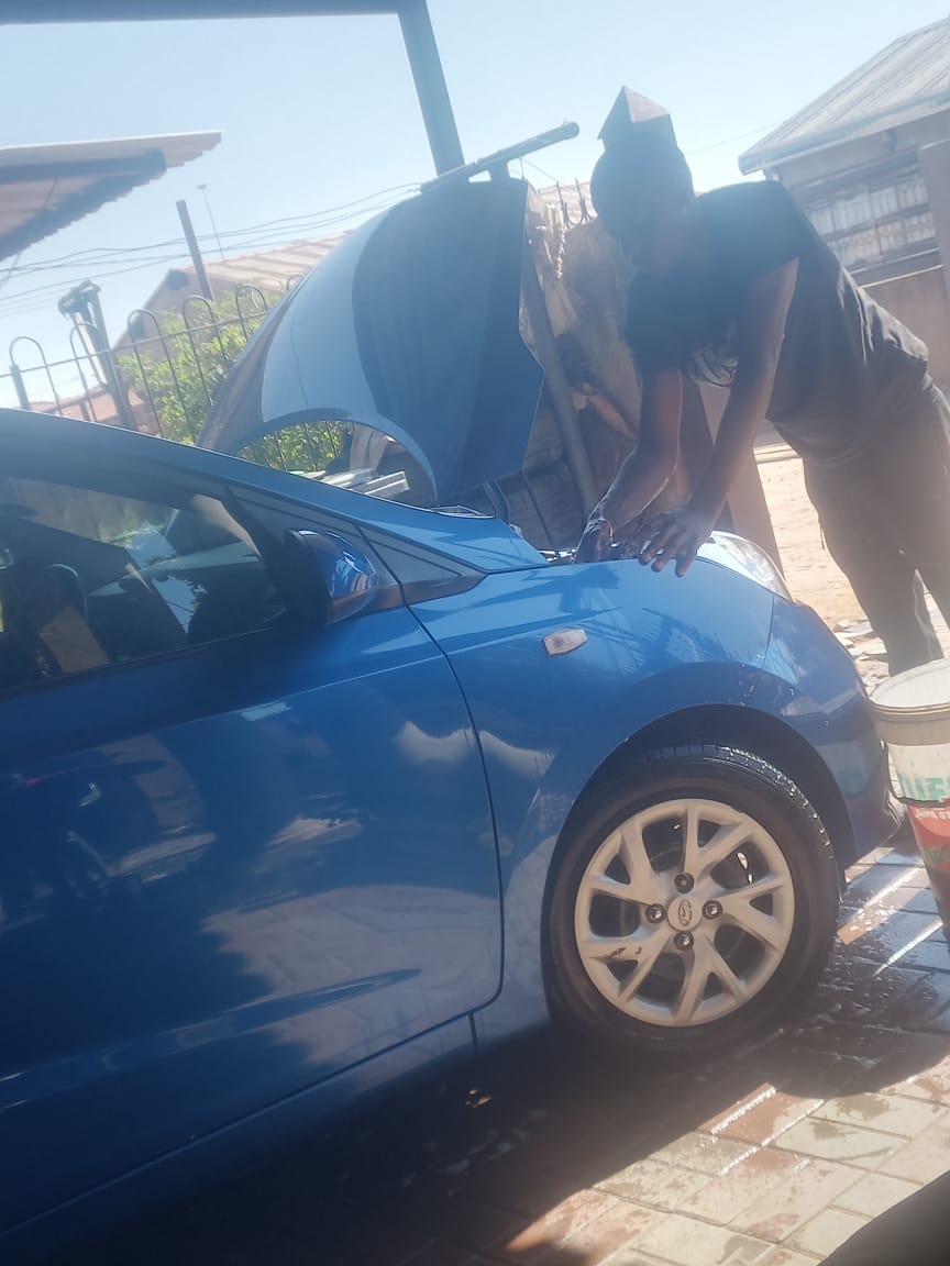 Close-up of engine work on blue Hyundai